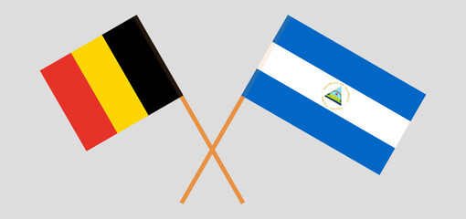 Crossed flags of Belgium and Nicaragua. Official colors. Correct proportion