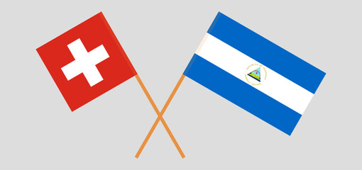 Crossed flags of Switzerland and Nicaragua. Official colors. Correct proportion