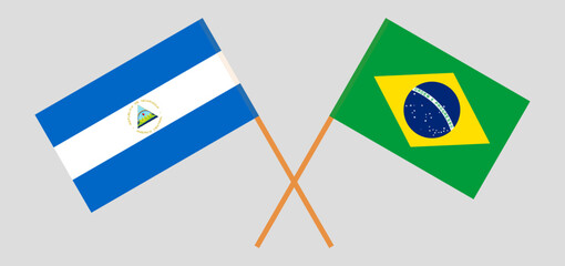 Crossed flags of Nicaragua and Brazil. Official colors. Correct proportion