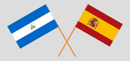 Crossed flags of Nicaragua and Spain. Official colors. Correct proportion