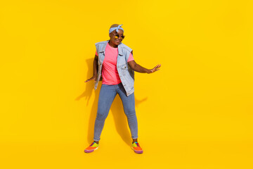 Fototapeta na wymiar Full body portrait of overjoyed satisfied person have fun clubbing disco isolated on yellow color background