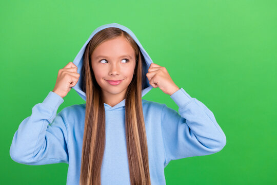 Photo portrait of funny sporty girl model look empty space discount poster wear stylish blue sportswear isolated on green color background