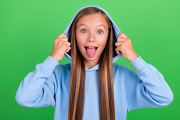 Photo portrait of funky naughty little girl hands touch hood tongue out dressed trendy blue...
