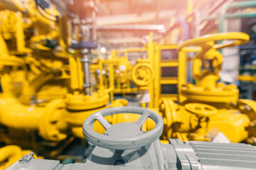 Oil and gas factory plant with pipeline red valves with sunlight