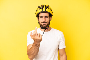 crazy bearded man feeling angry, annoyed, rebellious and aggressive. bike helmet concept