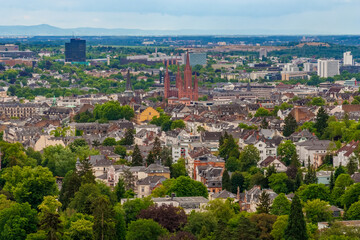 Great panoramic view of the historic Old Town of Wiesbaden, state capital of Hesse, Germany, with the famous neo-Gothic red all-brick Marktkirche (Market Church) in the centre at Schlossplatz. 