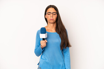pretty hispanic woman feeling sad and whiney with an unhappy look and crying. presenter with a...