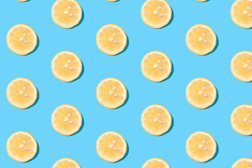 Summer pattern of yellow lemon slices on light-mint background