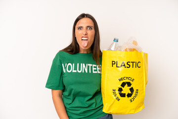 hispanic young adult woman feeling disgusted and irritated and tongue out. recycle and ecology...