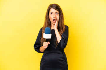 pretty caucasian woman feeling shocked and scared. tv presenter concept
