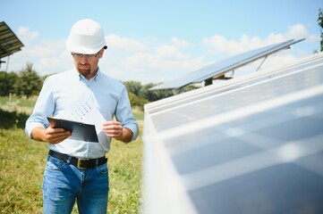 confident man and power solar station