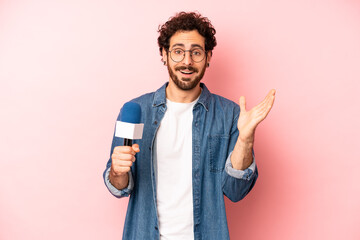 crazy bearded man feeling happy, surprised realizing a solution or idea. presenter with a...