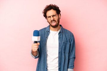 crazy bearded man feeling disgusted and irritated and tongue out. presenter with a microphone...