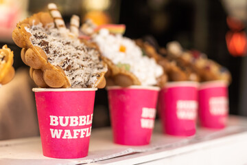 Different types of bubble waffle ice cream to go.