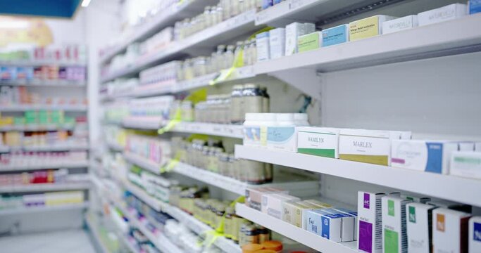 Pharmacy medicine, pills and drugs on shelf for treatment, cures and healing illness, sickness and disease. Closeup of variety of boxes, bottles and medication containers in drugstore stock for sale