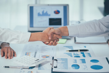 Obraz na płótnie Canvas Business handshake on company office background, partnership trust, respect sign