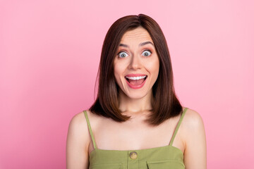 Fototapeta premium Photo of lovely pretty adorable girl with bob hairdo dressed khaki tank impressed staring at discount isolated on pink color background