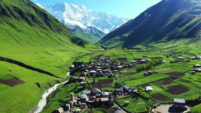 Aerial view of Ushguli village against highest georgian mountain Shkhara in Georgia.