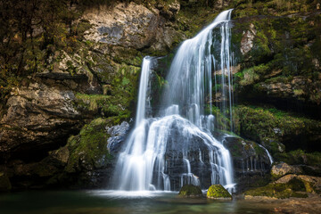 Fototapeta na wymiar Beautiful Waterfall Virje on River Gljun near town of Bovec in Slovenia