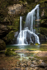 Beautiful Waterfall Virje on River Gljun near town of Bovec in Slovenia