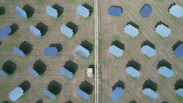 Silicon photovoltaic panels with defective single-axis tilted track system In a small solar power plant. 