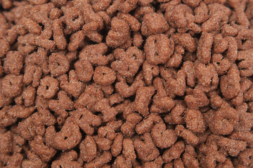 chocolate corn flakes in a bowl on table