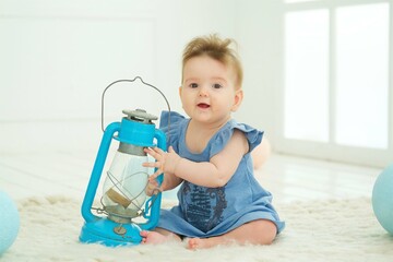 Naklejka premium A small newborn baby is in a bright room. The concept of childhood