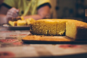 Rosy tasty sweet yellow farina pie, cut into pieces for tea drin