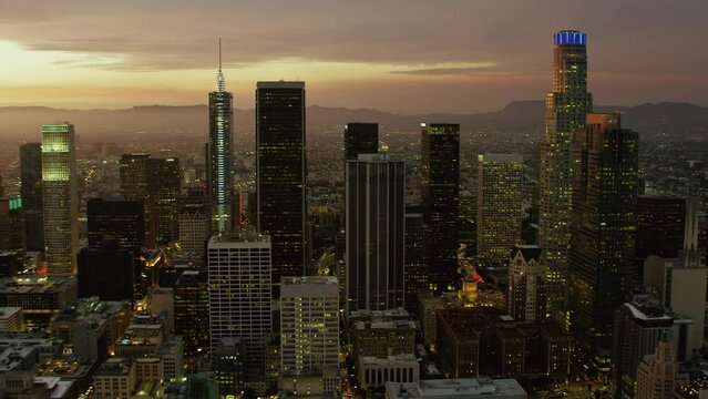 
Magnificent Aerial View of Los Angeles at Sunset. Skyscrapers in the Financial District. Blurred Brands and Logos.United Sates. California. Shot in 8K.