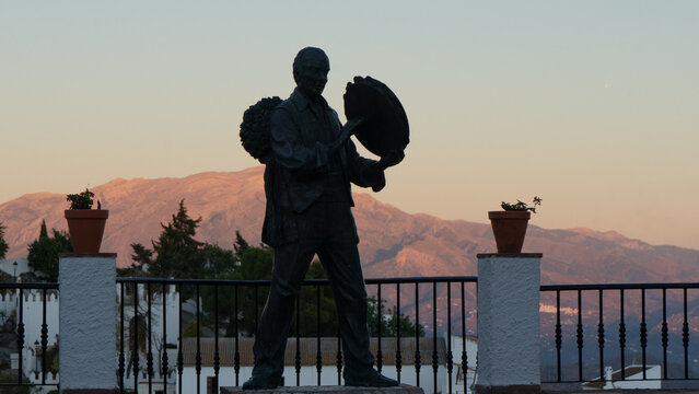 COMARES FIESTERO STATUE AT SUNSET IN COMARES, VERDIALES SQUARE