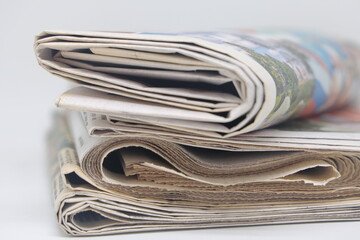 A stack of newspapers, news, corrupt journalism. They are ready for distribution to readers