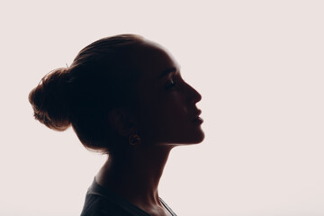 Young beautiful woman silhouette profile portrait isolated. - obrazy, fototapety, plakaty