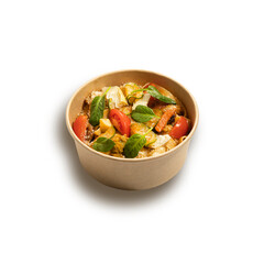 pasta with different types of vegetables (zucchini, tomato, cabbage, pepper) in a box on a white background