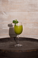 Green cocktail and lime garnish 
