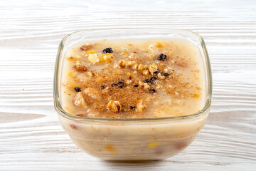 Ashure Day Concept.Traditional Turkish Dessert Ashure or Noah's Ark Pudding in bowls