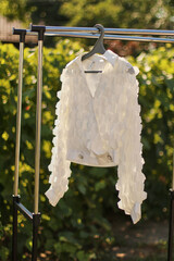 A beautiful stylish summer blouse on a hanger
