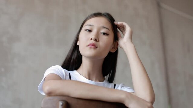 Portrait of a beautiful young Asian model looking at the camera.