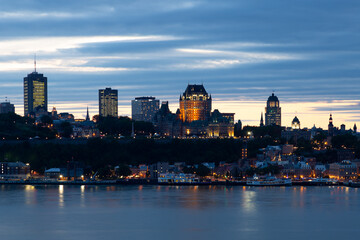 The Quebec City old town’s skyline seen during a summer night, with the St. Lawrence River in the foreground, Levis, Quebec, Canada