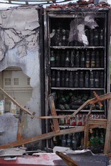 Burnt goods in refrigerators in a store after a fire.