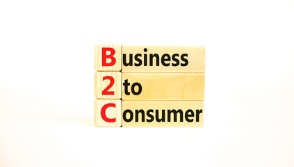 B2C business to consumer symbol. Concept words B2C business to consumer on wooden blocks on a beautiful white table white background. Business and B2C business to consumer concept. Copy space.