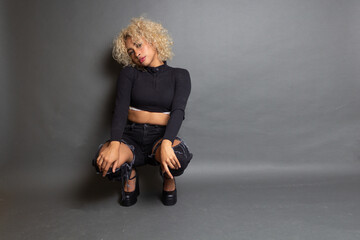 fashion female model brunette squatting