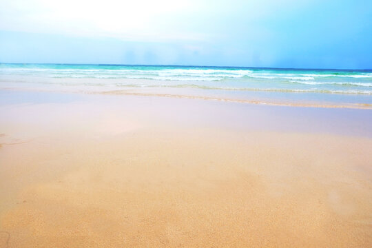 The beautiful beach and blue sea for background and wallpaper, abstract and postcard