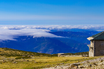 Fototapeta na wymiar Wind turbines above clouds in Serra da Estrela, Portugal.