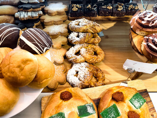 Mix of freshly baked pastries exposed in a bakary shop