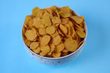 corn flakes in a shelf on a blue background top view