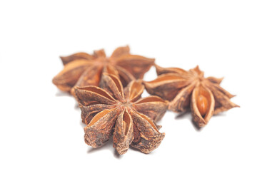 A group of star anises isolated on white background. Dried star anise spice fruits top view.