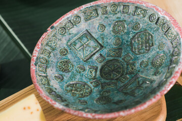 vintage kitchen ceramic bowl with traditional ornament closeup, setting the dining table with ceramic dishes