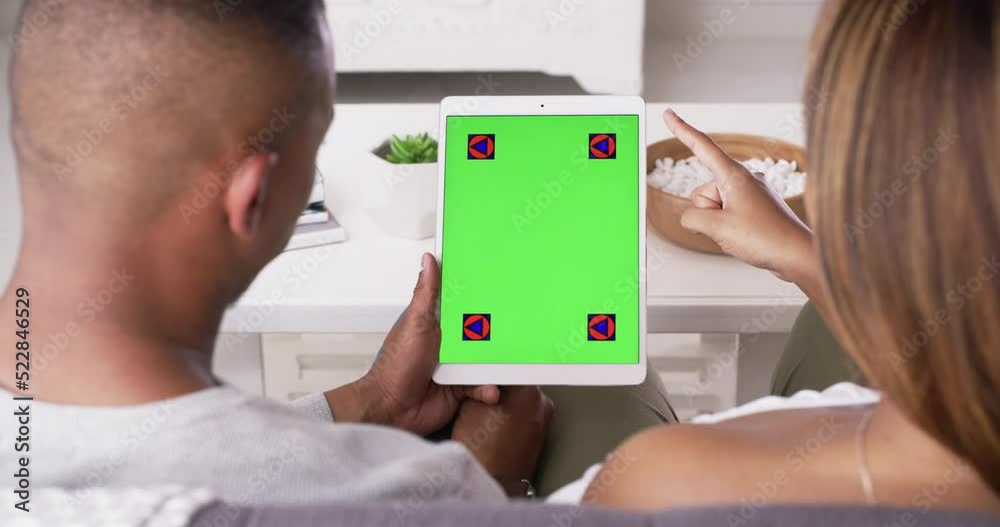 Poster greenscreen, copyspace or chromakey with tracking markers in the hands of a couple at home from abov