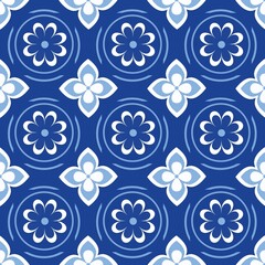 Blue white seamless background with flowers..Abstract, repeating regular pattern for print..Graphic design with regular shapes.