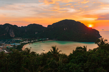 Sunset at the Phi Phi Island viewpoint. silhouette of the island and palm trees on the background of the sunset. © Konstantin